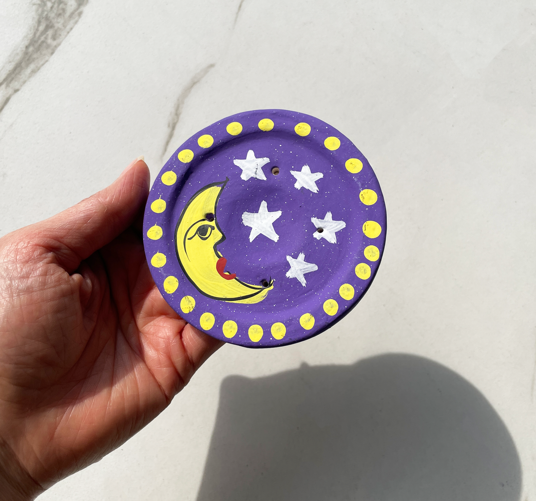 4 inch round hand painted terracotta purple incense burner with yellow crescent moon and white star design for incense sticks and cones bliss shop chicago