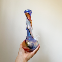 10 inch soft glass bong with iridescent orange-y red, blue and white swirl bliss shop chicago