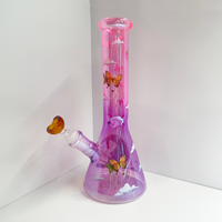 10 inch beaker bong with light purple base that transitions to bright pink at top with large celestial moon, butterflies and cloud decals bliss shop chicago