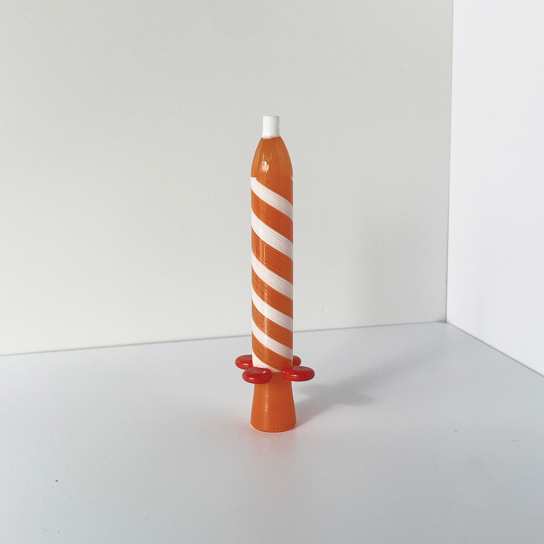4.25 inch birthday candle design glass chillum with orange and white swirl and orange flared base bliss shop chicago