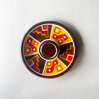 4 inch ceramic dish for palo santo sticks with peruvian geometric design in red orange and brown bliss shop chicago