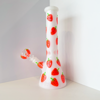10 inch white beaker bong with bright red strawberry designs that glow in the dark bliss shop chicago