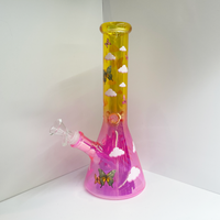 10 inch beaker bong with a bright pink base that transitions to yellow gold at top with large celestial sun, butterflies and cloud decals bliss shop chicago