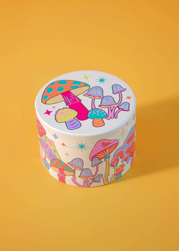 canna style 2.5 inch diameter 4 piece pink aluminum grinder with bright and colorful mushroom and star designs bliss shop chicago