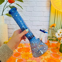 12 inch blue beaker style bong with small glow in the dark star designs all over bliss shop chicago