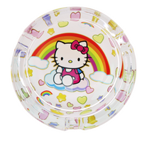 3.3" glass ashtray designed with hello kitty sitting on a cloud with a large rainbow, hearts and stars in the background bliss shop chicago