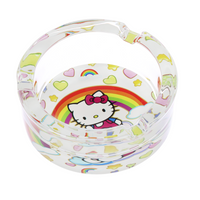 3.3" glass ashtray designed with hello kitty sitting on a cloud with a large rainbow, hearts and stars in the background bliss shop chicago