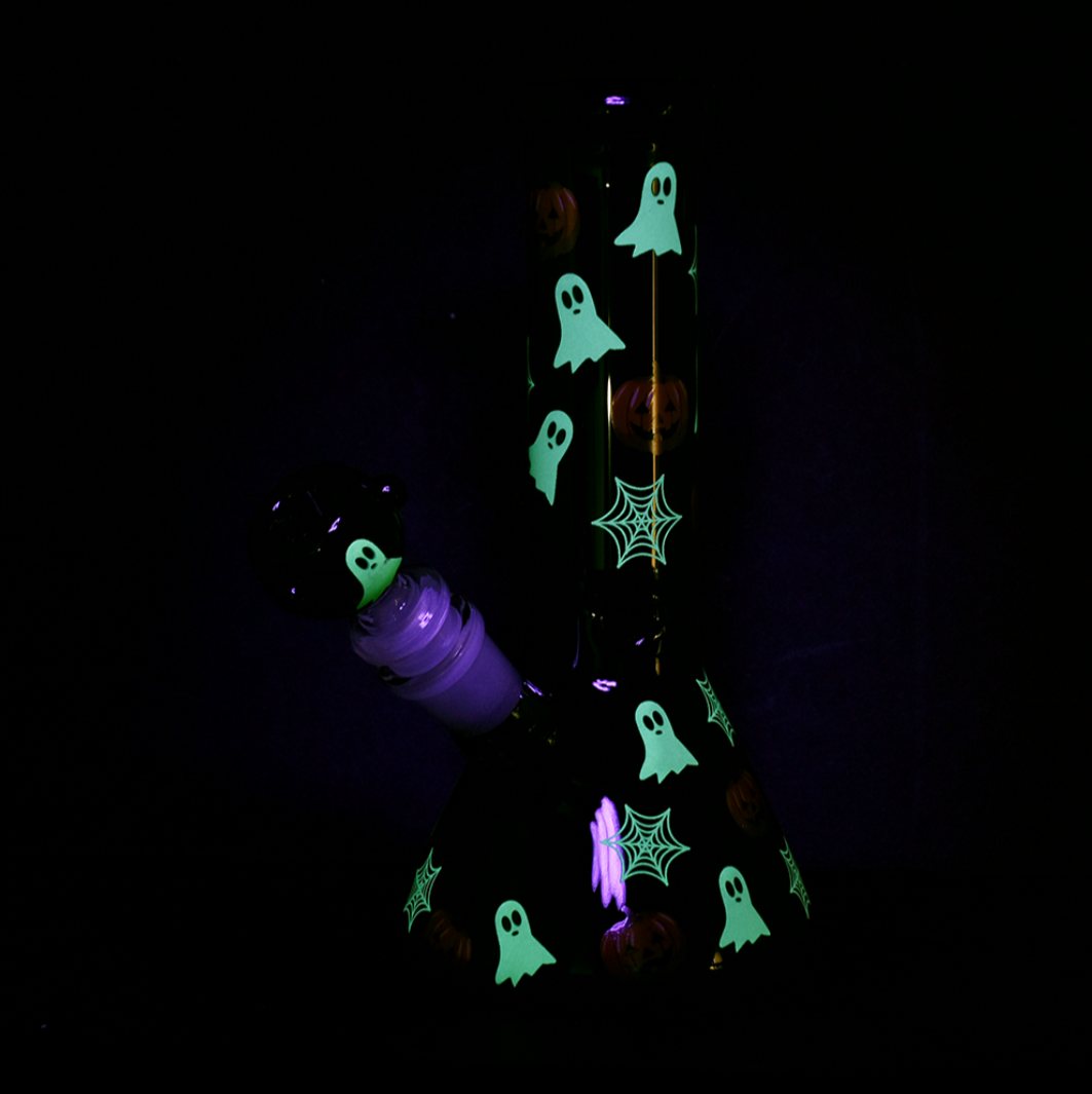 8 inch tall glow in the dark black beaker with jack o lantern pumpkins ghosts and cobweb design bliss shop chicago