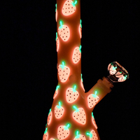 10 inch white beaker bong with bright red strawberry designs that glow in the dark bliss shop chicago