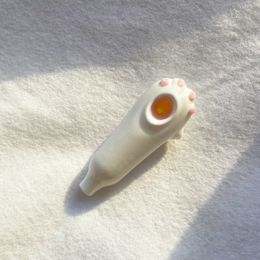 White ceramic cat paw smoking pipe with pink toe beans bliss shop chicago