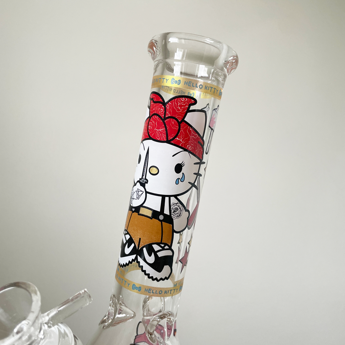 10 inch beaker bong with hello kitty dressed like thug holding knife decal design bliss shop chicago