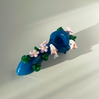 four inch blue spoon pipe with intricate designs of 3d pink flowers, koi fish and leaves bliss shop chicago
