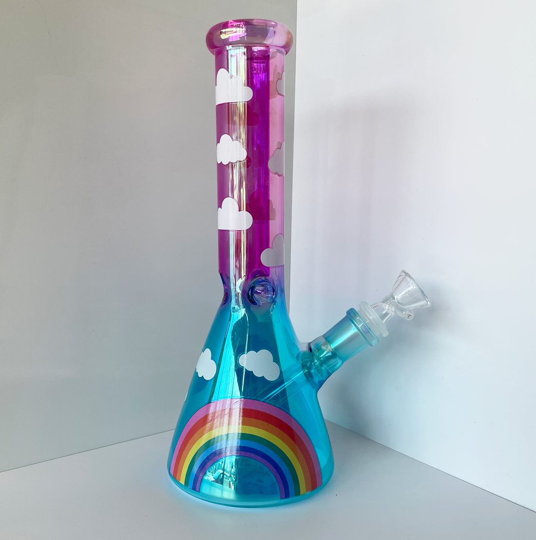 10 inch beaker bong with hot pink and blue ombre color way and rainbow and cloud decals bliss shop chicago