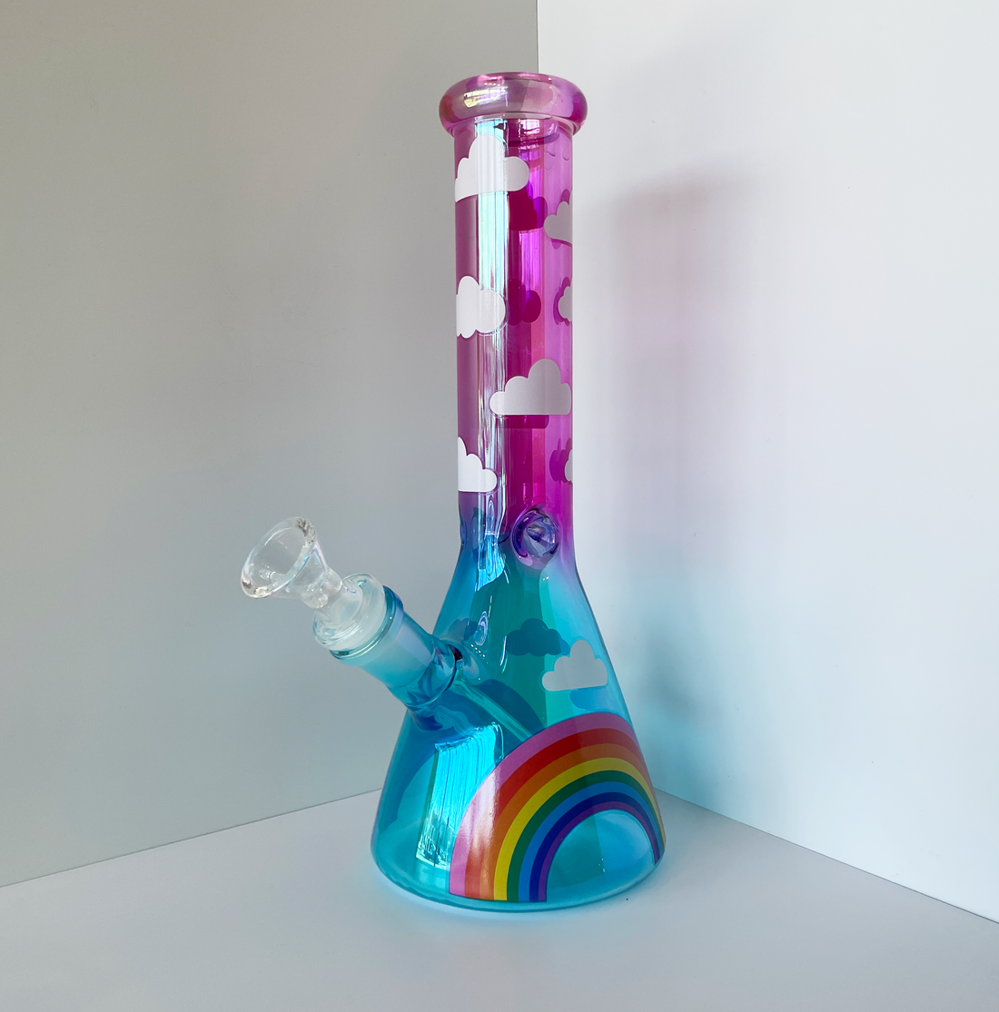 10 inch beaker bong with hot pink and blue ombre color way and rainbow and cloud decals bliss shop chicago