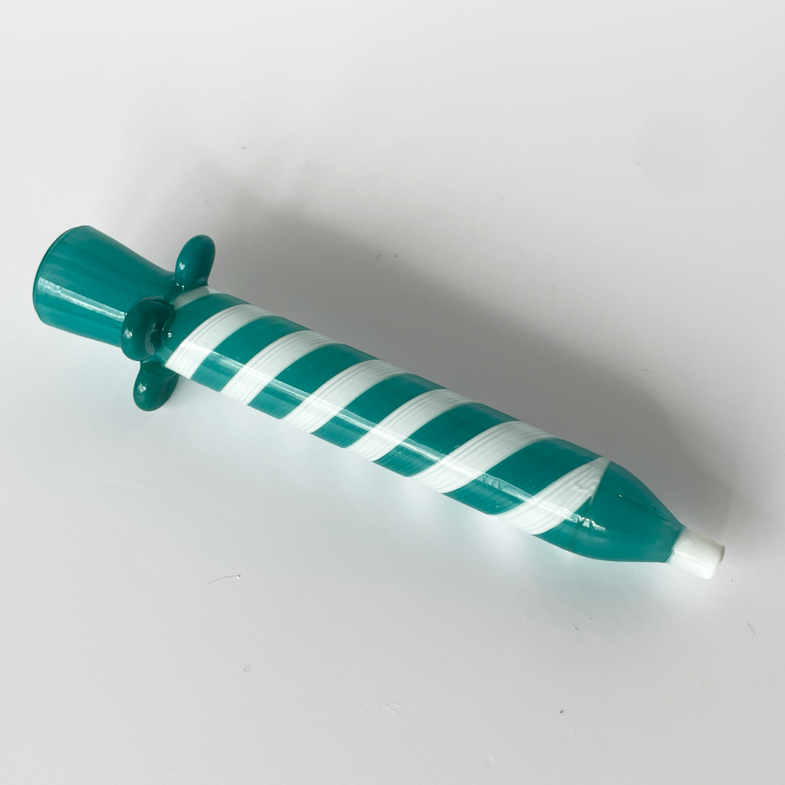 4.25 inch birthday candle design glass chillum with teal and white swirl and teal flared base bliss shop chicago